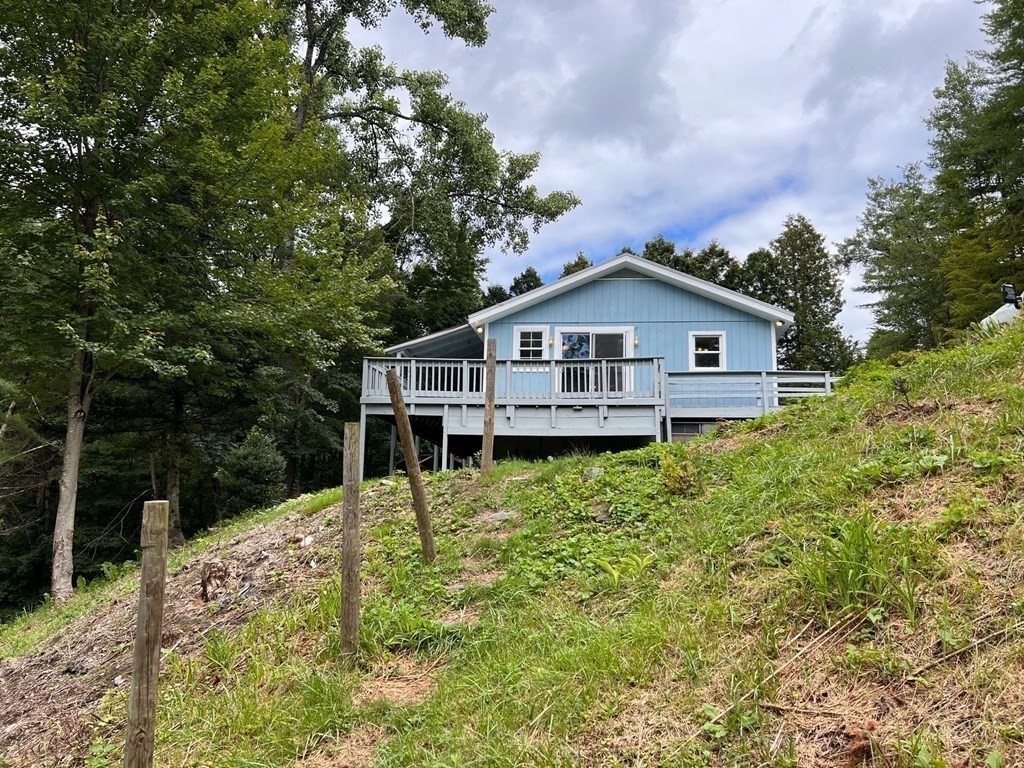 2 Cider Mill Lane Colrain, MA 01340 - Photo 6 of 32 a view of house with a big yard plants and large trees