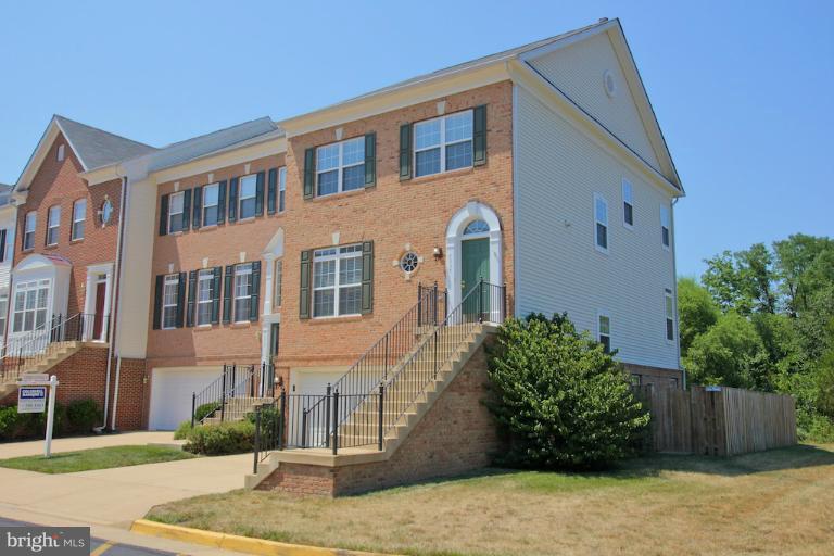 7335 Hampton Manor Place Springfield, VA 22150 - Photo 22 of 22 a front view of a house with garden