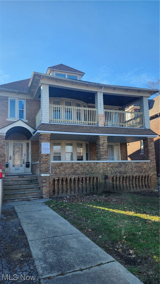 3228 Berkeley Road Cleveland, OH 44118 - Photo 1 of 26 View of front of property featuring a front yard and a balcony