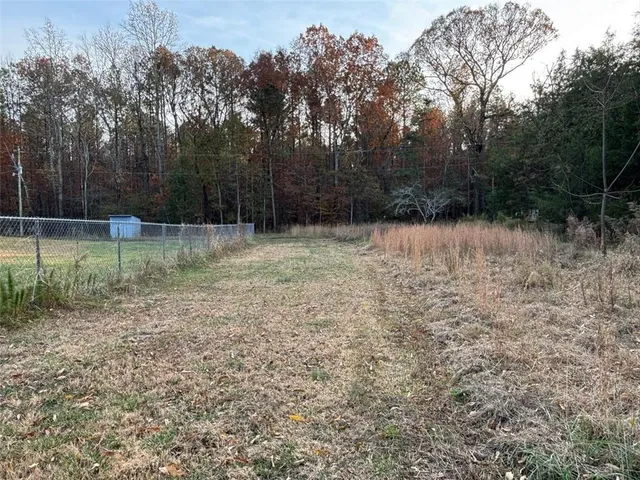 a backyard of a house with lots of green space