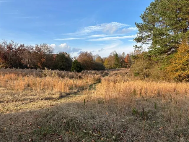 a view of lake with mountain in background
