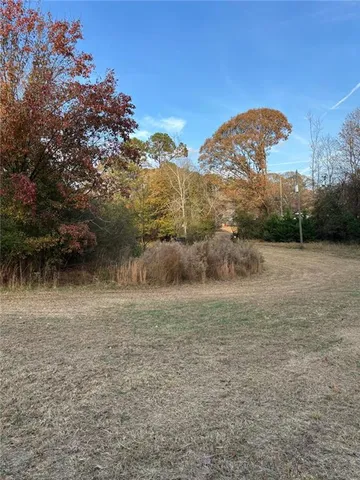 a view of a lake with a yard