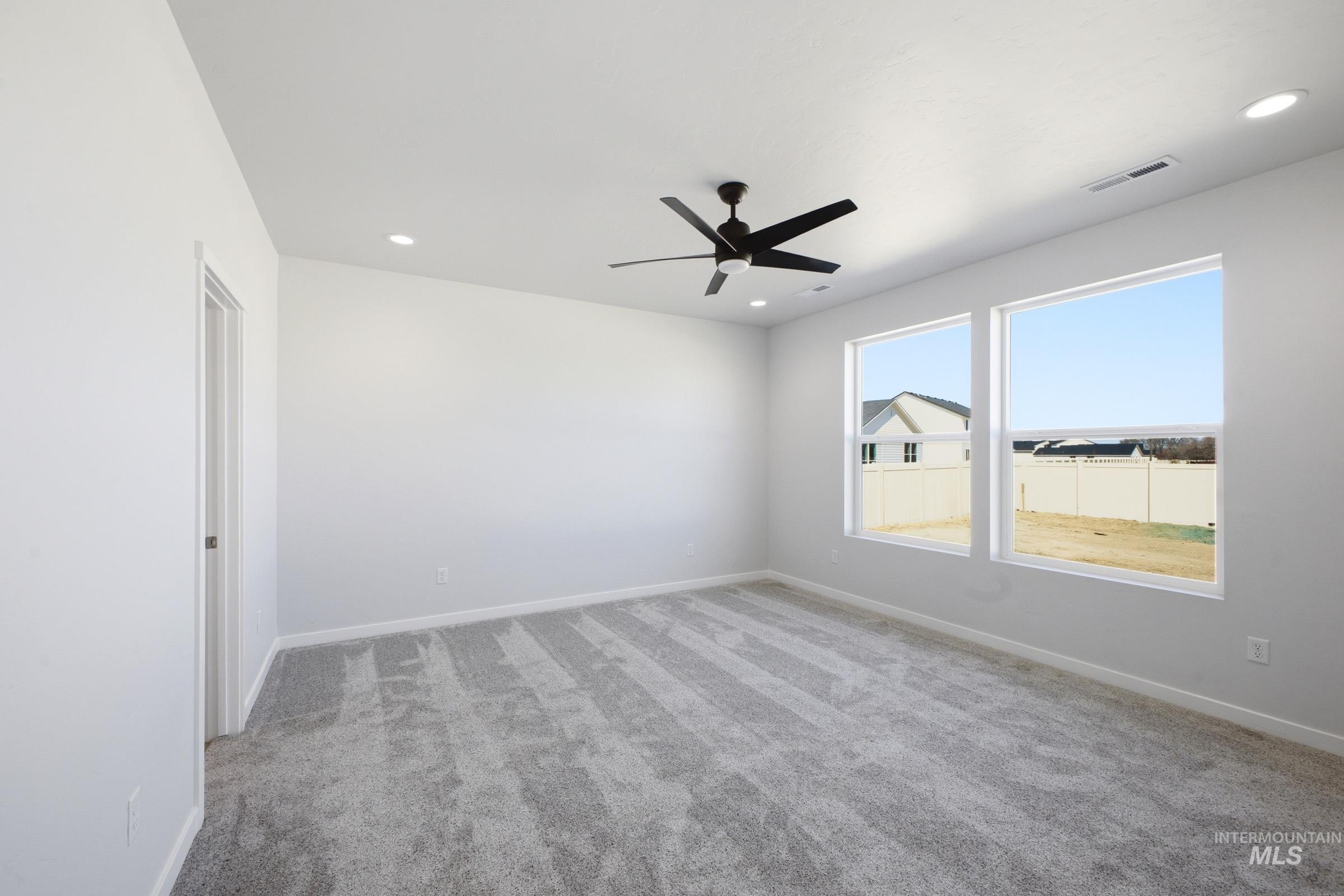 13633 Redway Court Caldwell, ID 83607 - Photo 22 of 29 Unfurnished room with light carpet, a ceiling fan, and recessed lighting