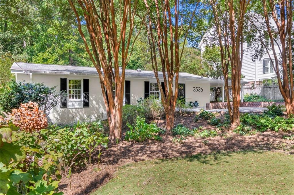 3536 Keswick Drive Atlanta, GA 30341 - Photo 1 of 1 front view of a house with a garden