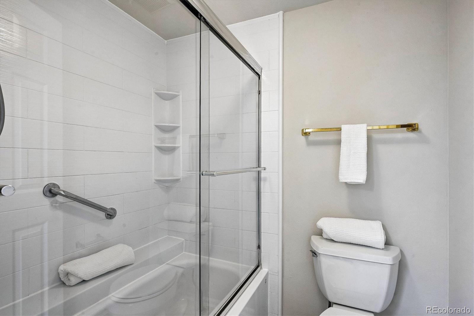 8624 Redstone Street Highlands Ranch, CO 80126 - Photo 14 of 26 a bathroom with a toilet and a shower