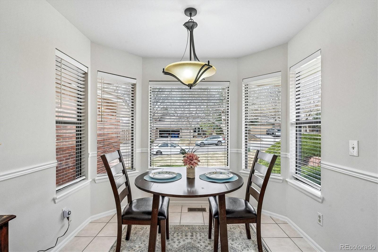 8624 Redstone Street Highlands Ranch, CO 80126 - Photo 10 of 26 a view of a dining room with furniture and window