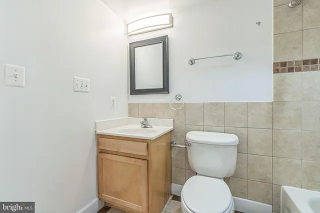 a bathroom with a shower and a bathtub