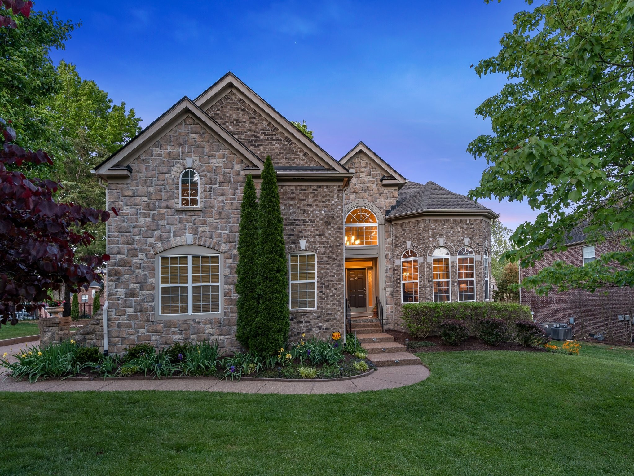 5028 Abington Ridge Lane Franklin, TN 37067 - Photo 1 of 68 a front view of a house with a yard