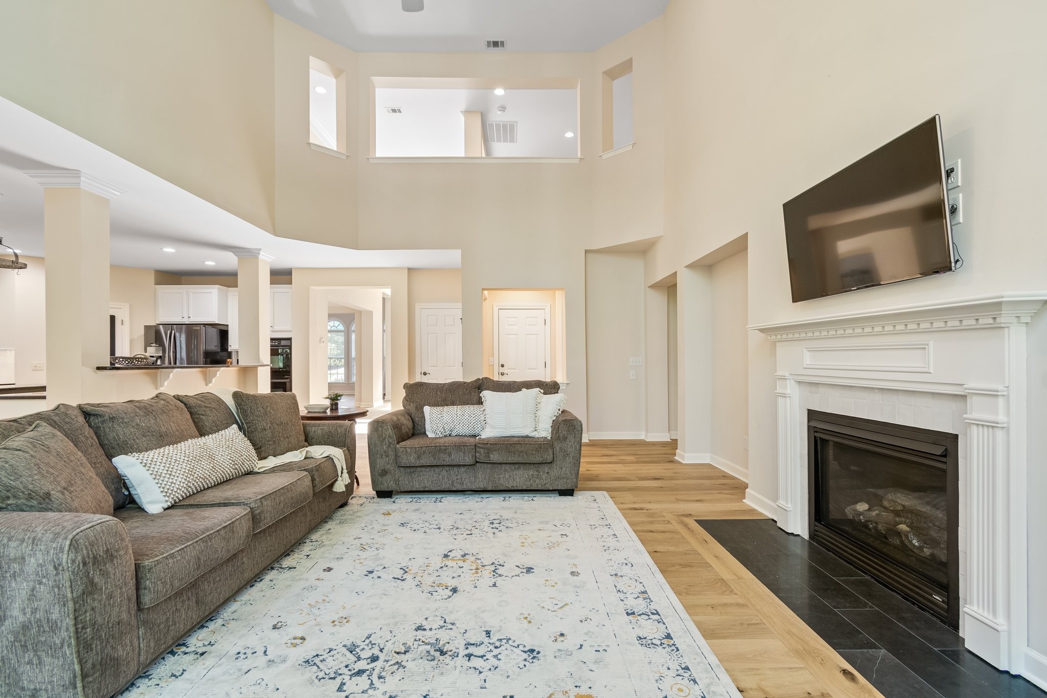 5028 Abington Ridge Lane Franklin, TN 37067 - Photo 19 of 68 a living room with furniture and a fireplace