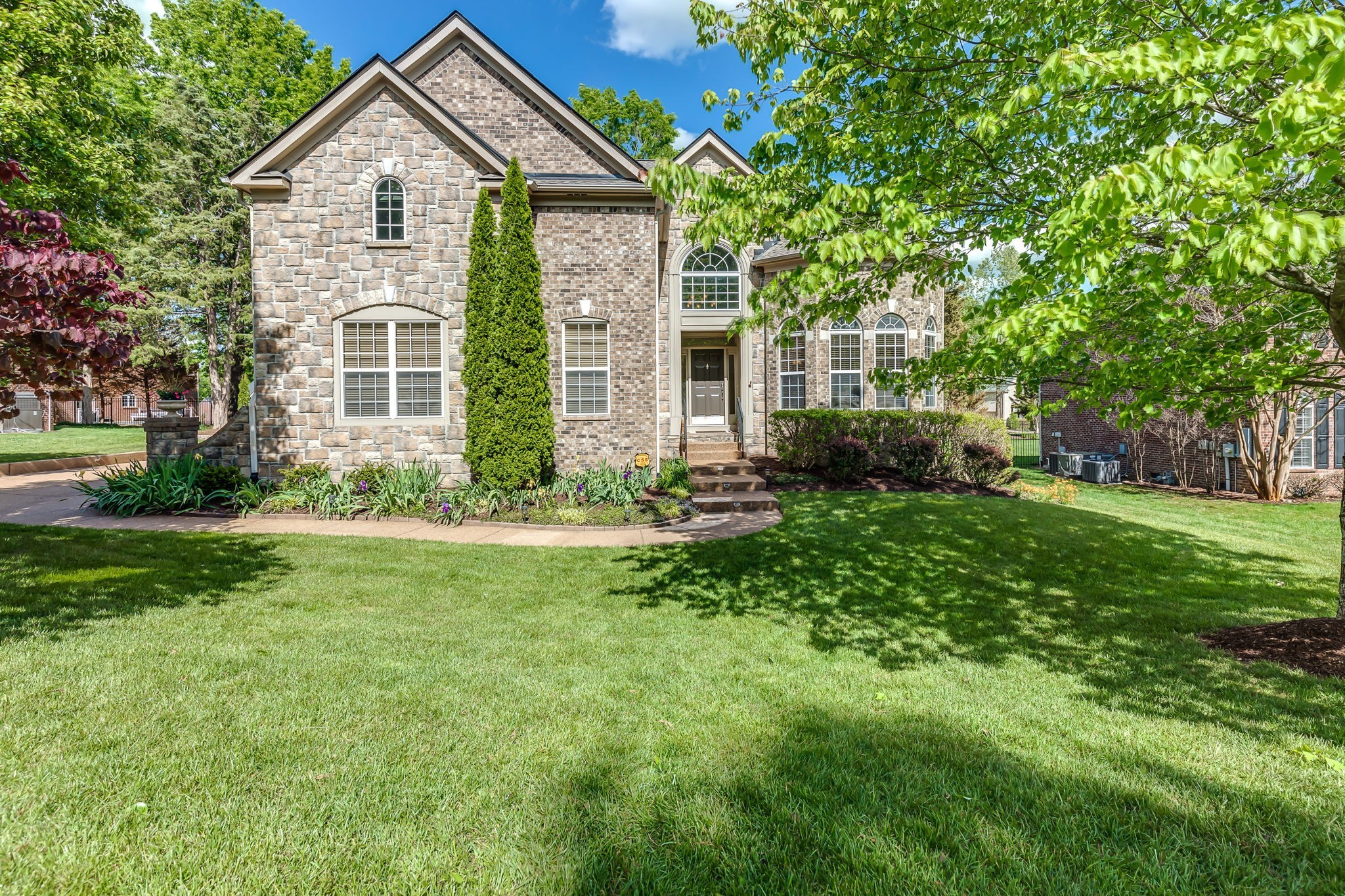 5028 Abington Ridge Lane Franklin, TN 37067 - Photo 2 of 68 a view of a house with yard and a garden