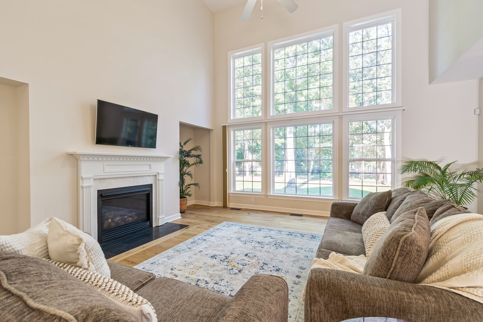 5028 Abington Ridge Lane Franklin, TN 37067 - Photo 21 of 68 a living room with furniture a fireplace and a flat screen tv
