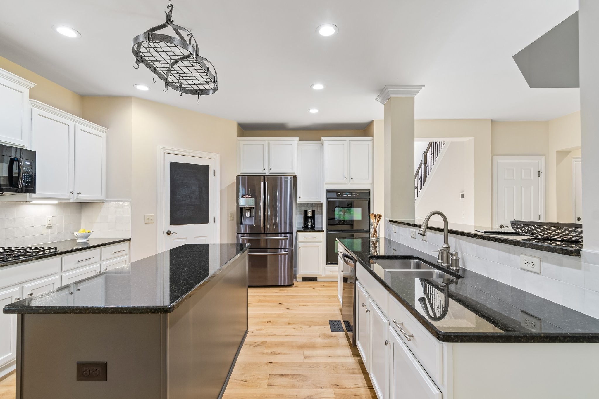 5028 Abington Ridge Lane Franklin, TN 37067 - Photo 24 of 68 a view of a kitchen with stainless steel appliances granite countertop a sink stove and refrigerator