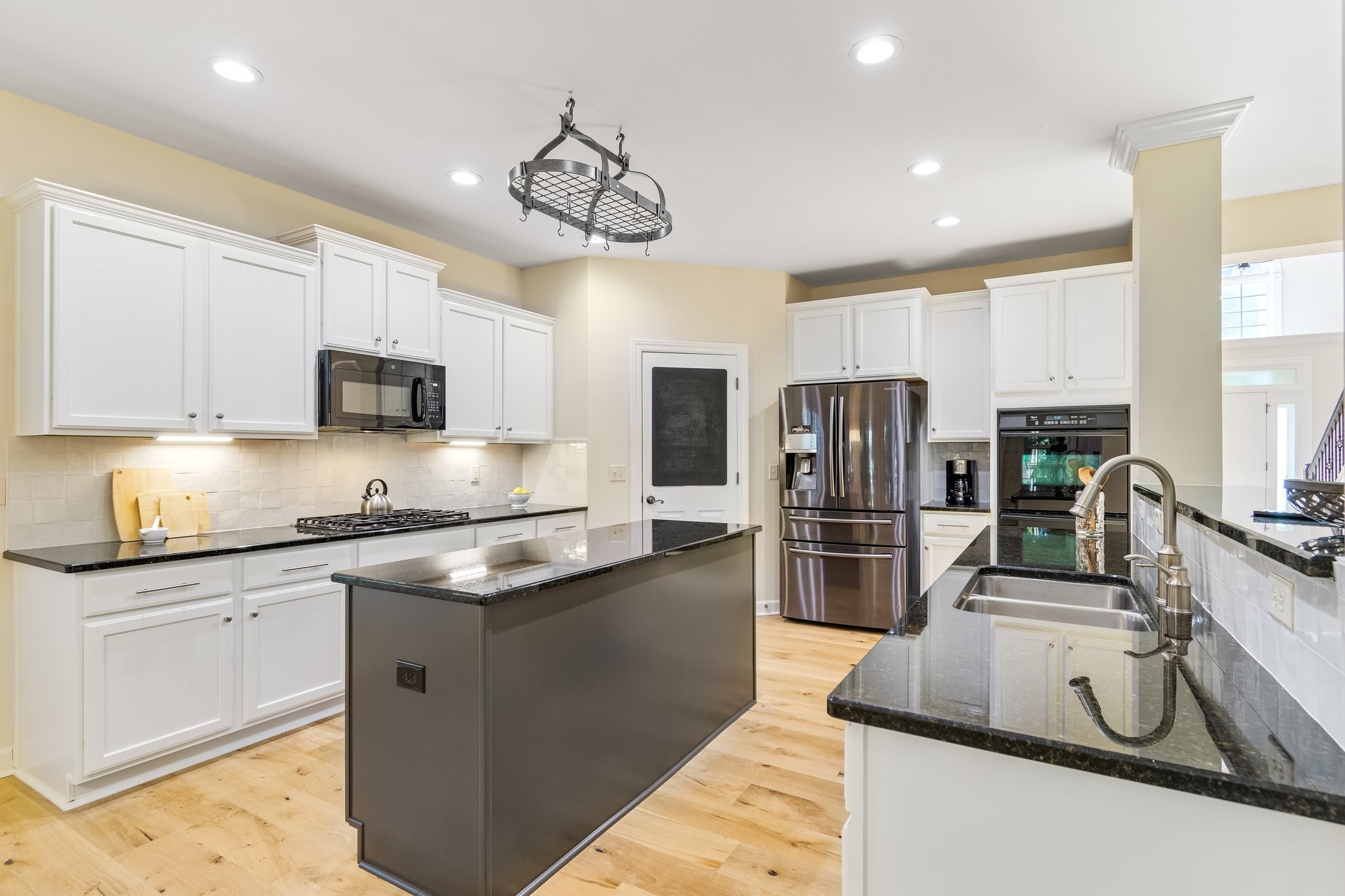5028 Abington Ridge Lane Franklin, TN 37067 - Photo 25 of 68 a kitchen with stainless steel appliances granite countertop a sink stove and refrigerator