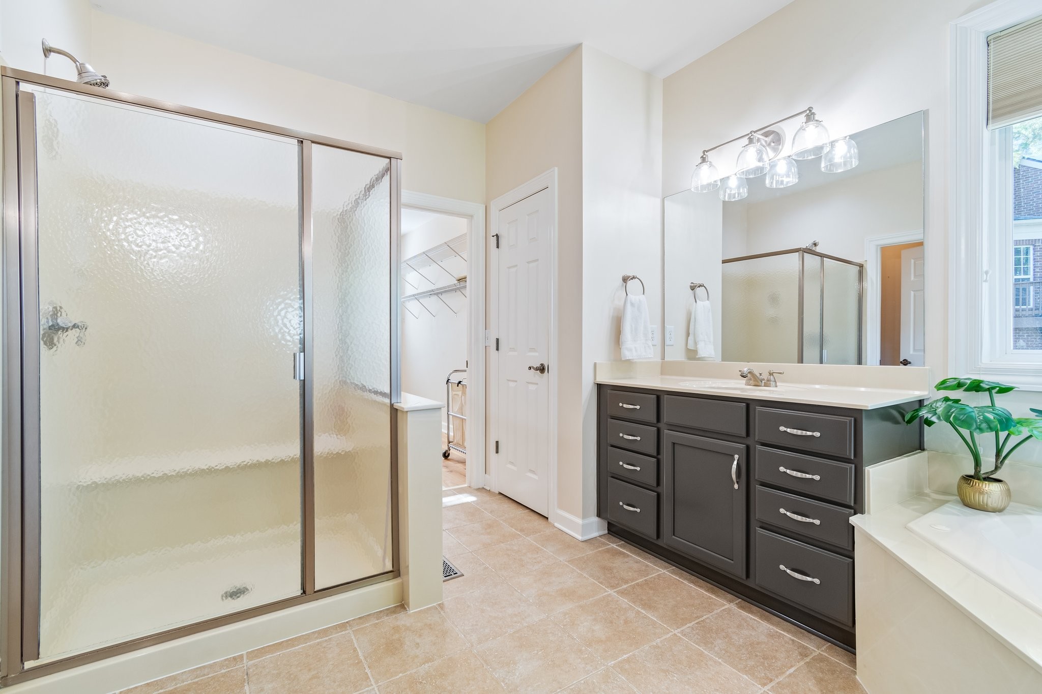 5028 Abington Ridge Lane Franklin, TN 37067 - Photo 40 of 68 a spacious bathroom with a granite countertop sink mirror and a shower