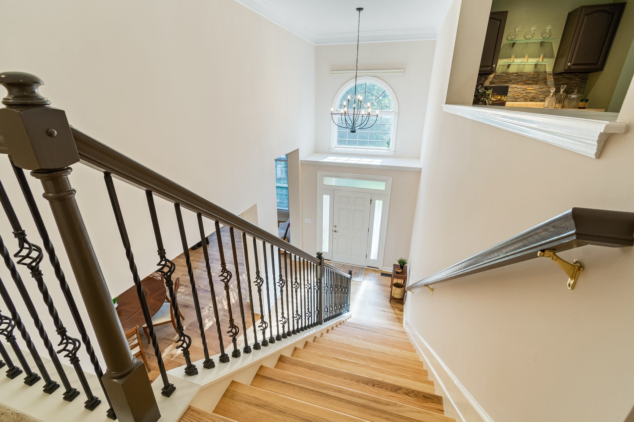 5028 Abington Ridge Lane Franklin, TN 37067 - Photo 42 of 68 a view of a hallway with wooden floor and staircase