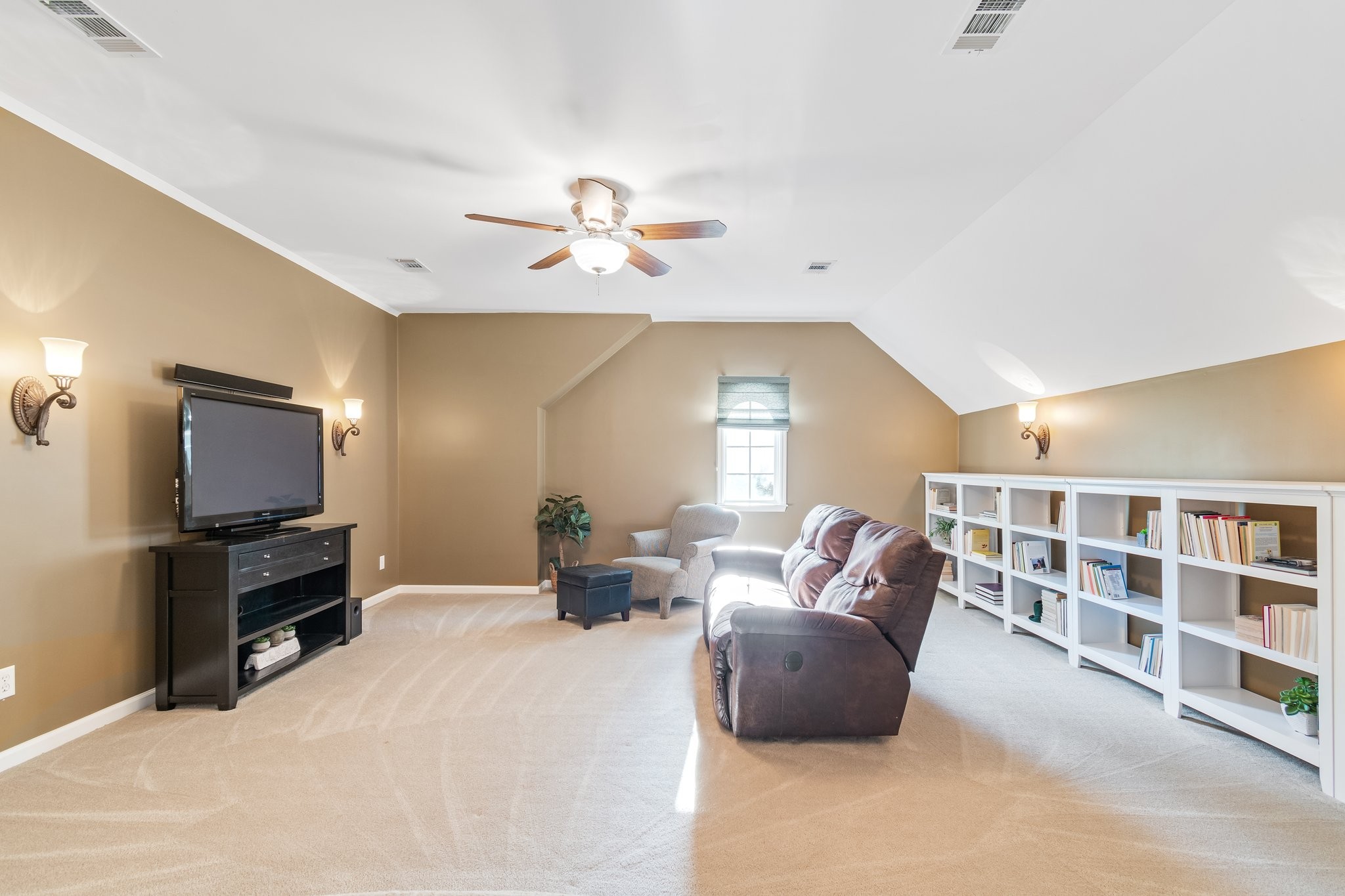 5028 Abington Ridge Lane Franklin, TN 37067 - Photo 48 of 68 a living room with furniture and a flat screen tv