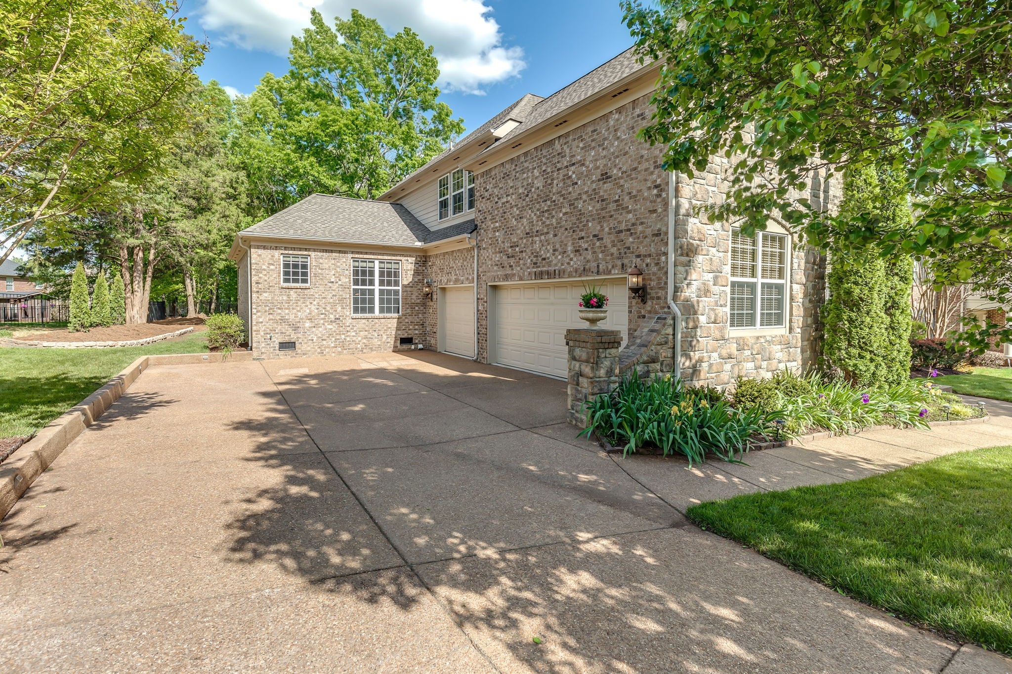 5028 Abington Ridge Lane Franklin, TN 37067 - Photo 6 of 68 a front view of a house with a garden and trees