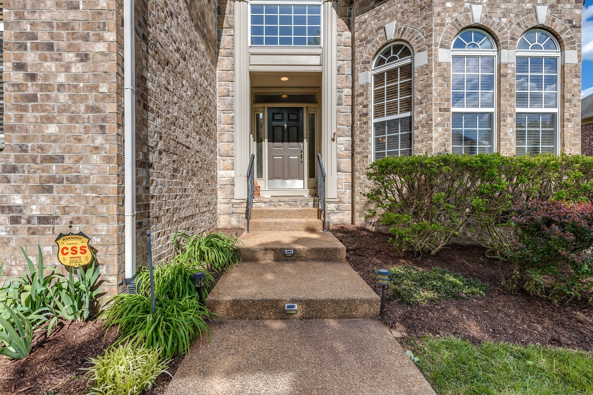 5028 Abington Ridge Lane Franklin, TN 37067 - Photo 7 of 68 a front view of a house with a yard and potted plants