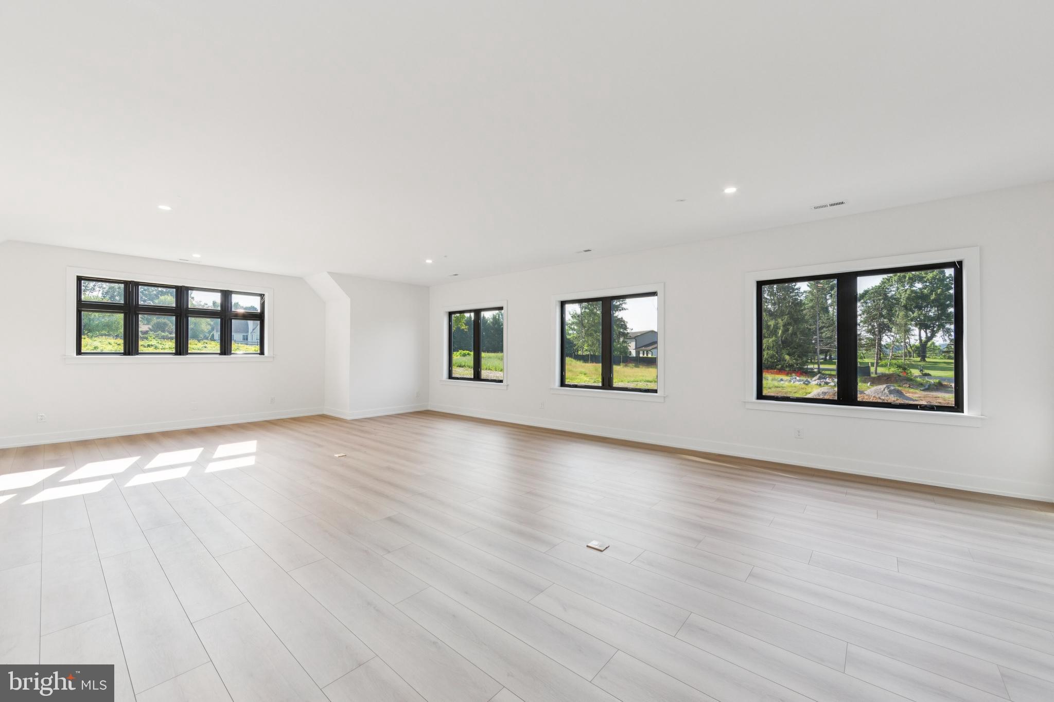 736 Northbrook Road, Unit L2 Kennett Square, PA 19348 - Photo 20 of 60 an empty room with wooden floor and windows