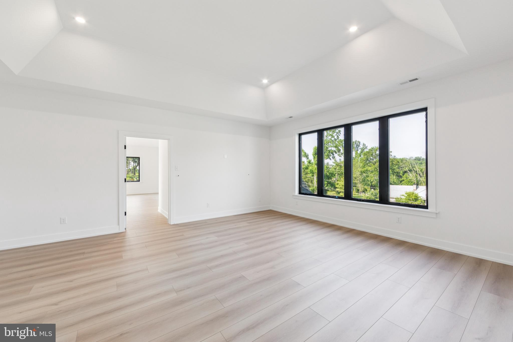 736 Northbrook Road, Unit L2 Kennett Square, PA 19348 - Photo 23 of 60 an empty room with wooden floor and windows