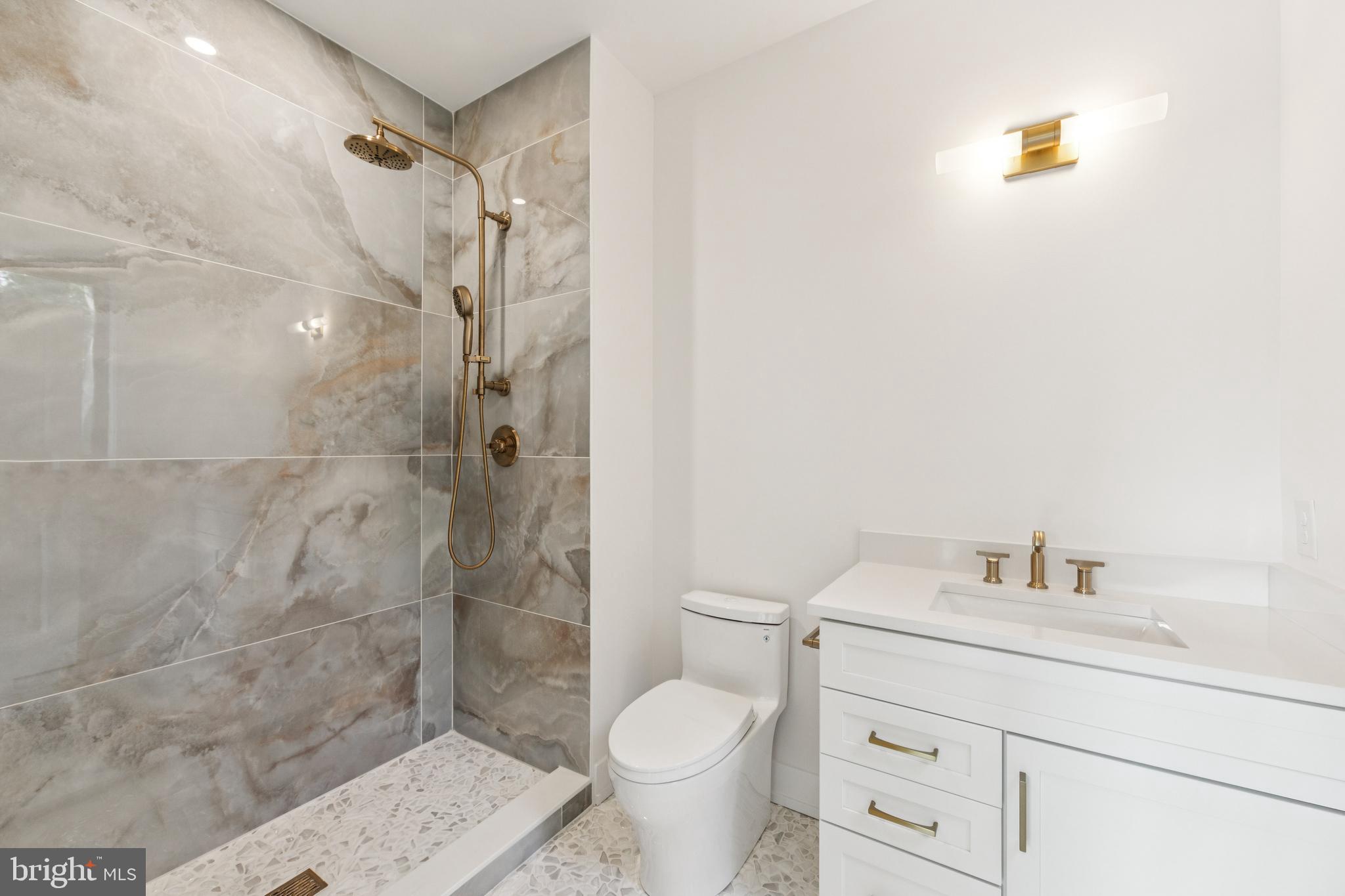 736 Northbrook Road, Unit L2 Kennett Square, PA 19348 - Photo 34 of 60 a bathroom with a sink toilet and shower