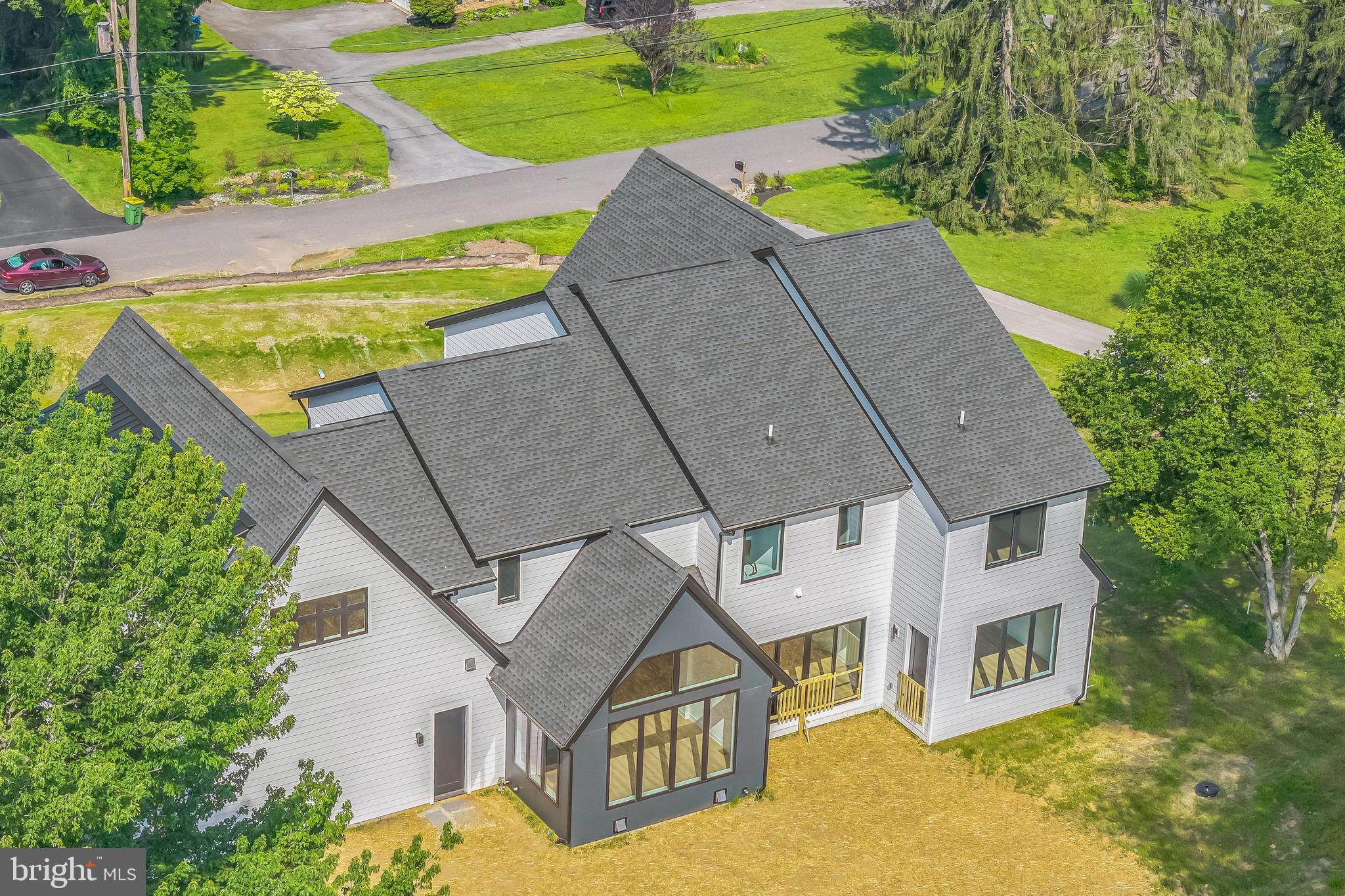 736 Northbrook Road, Unit L2 Kennett Square, PA 19348 - Photo 6 of 60 a aerial view of a house with a yard and plants