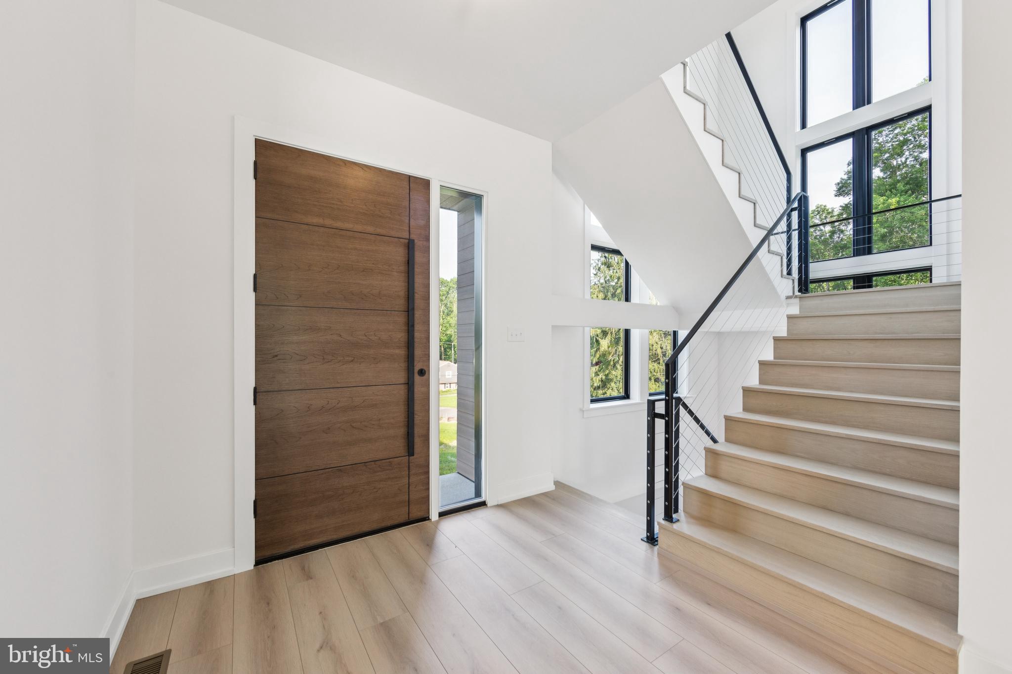 736 Northbrook Road, Unit L2 Kennett Square, PA 19348 - Photo 10 of 60 a view of entryway with wooden floor and stairs