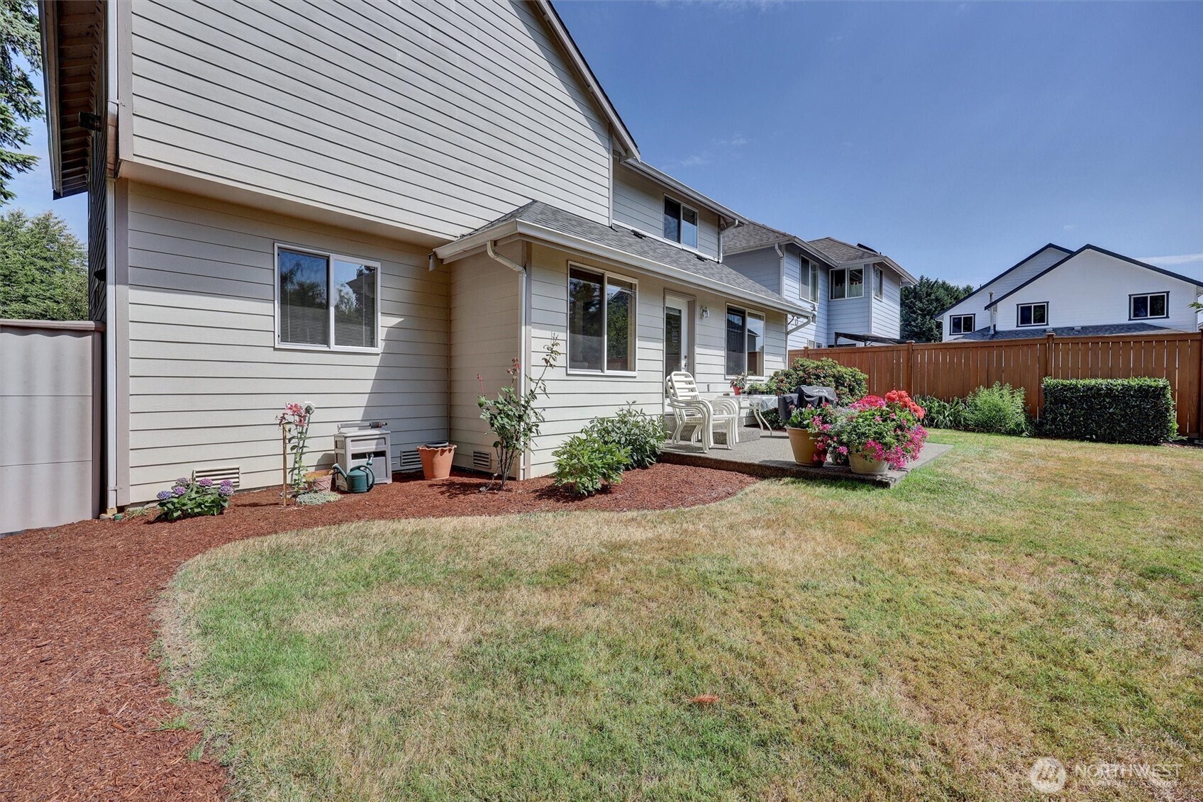 15403 Southeast 254th Street Covington, WA 98042 - Photo 20 of 22 a front view of a house with a yard and garage
