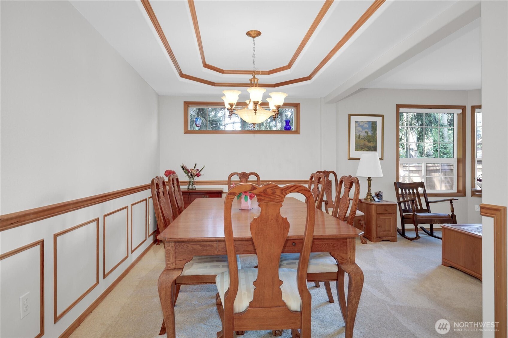 15403 Southeast 254th Street Covington, WA 98042 - Photo 9 of 22 a dining room with furniture a chandelier and a large window