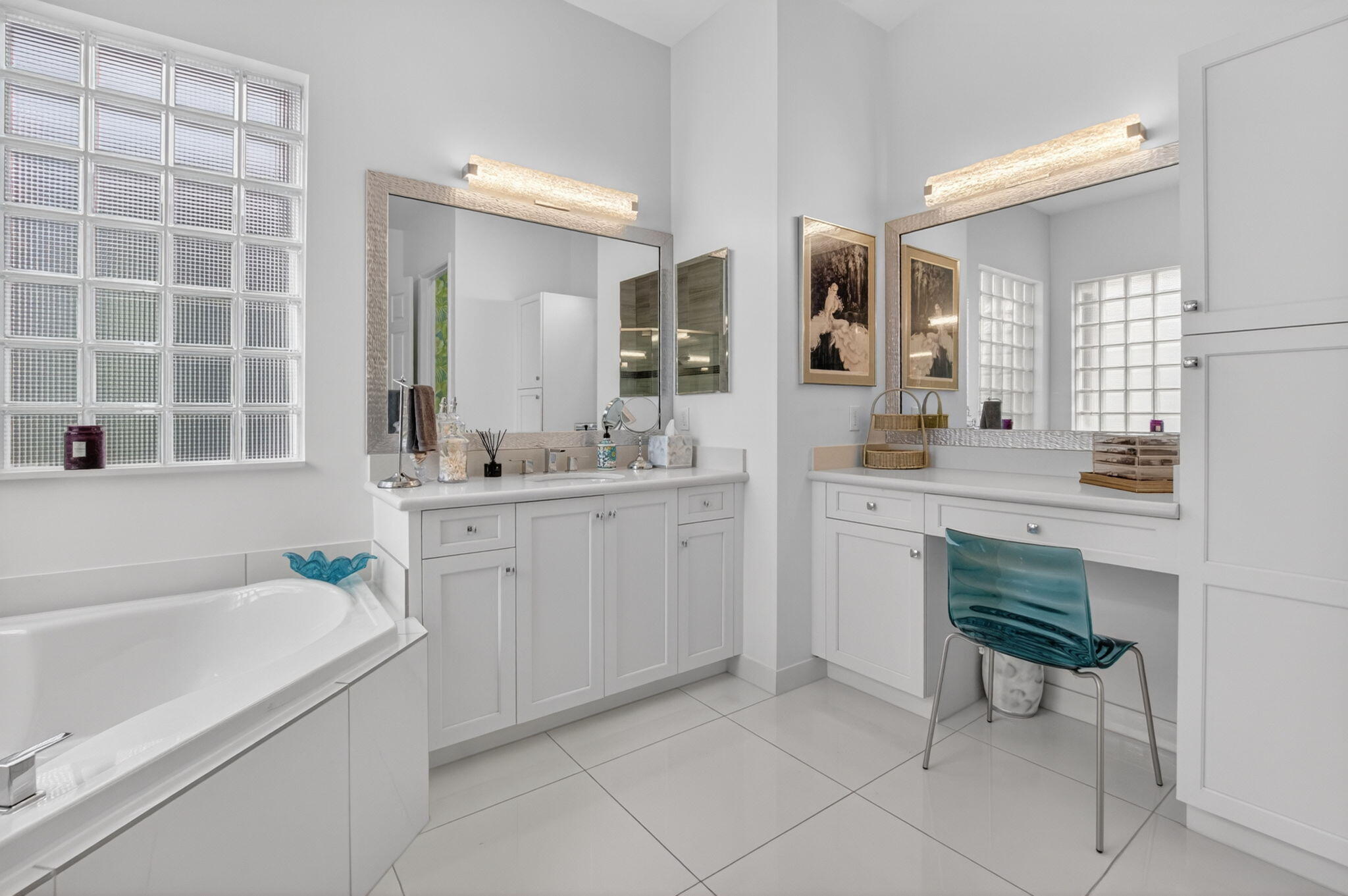 8263 Arabian Range Road Boynton Beach, FL 33473 - Photo 34 of 52 a bathroom with a sink double vanity and a bathtub