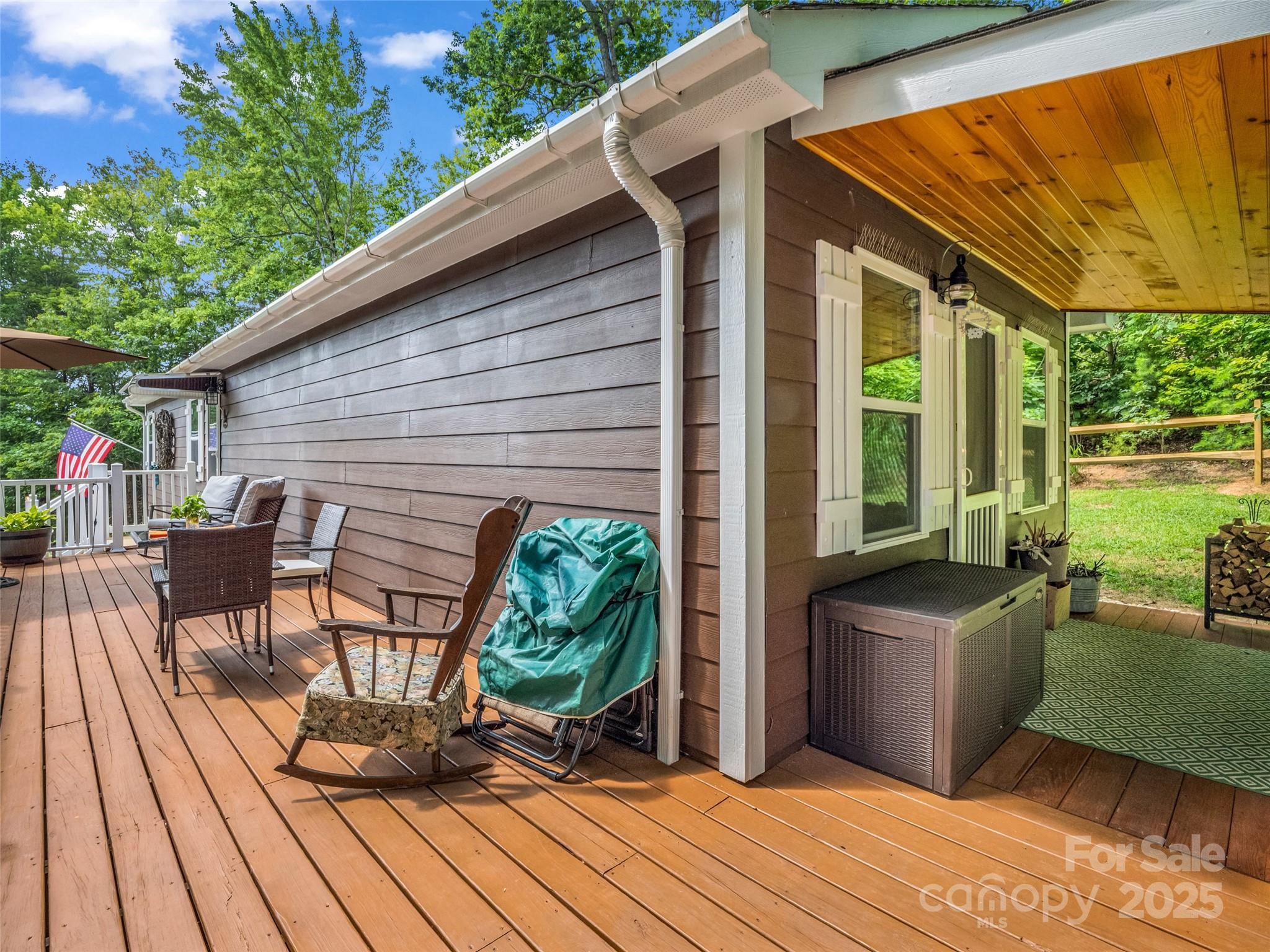 479 Camp Hill Road Mill Spring, NC 28756 - Photo 12 of 48 a backyard of a house with seating space