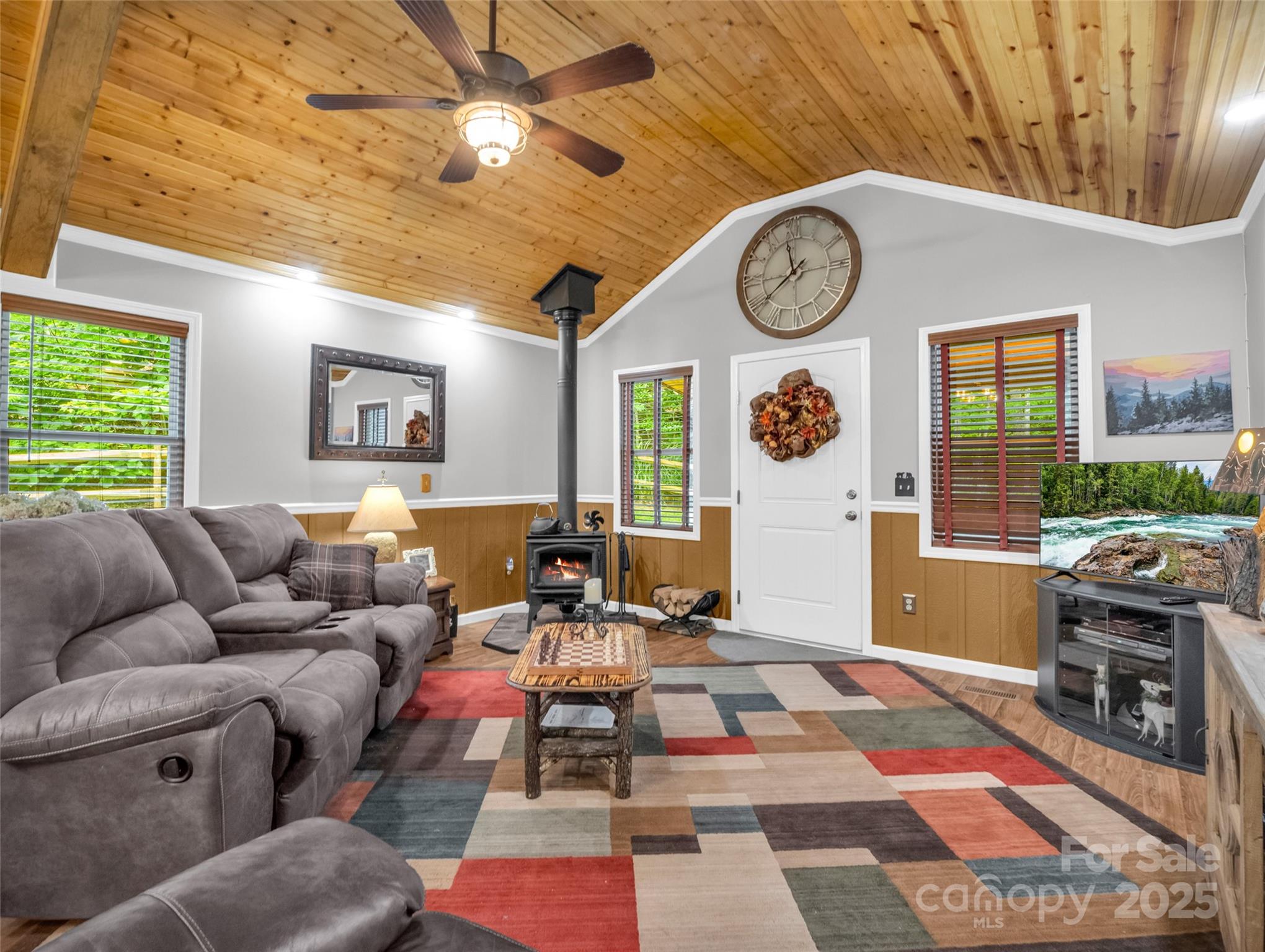 479 Camp Hill Road Mill Spring, NC 28756 - Photo 14 of 48 a living room with furniture a clock and a window