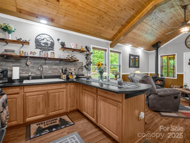 a kitchen with stainless steel appliances granite countertop a sink and cabinets