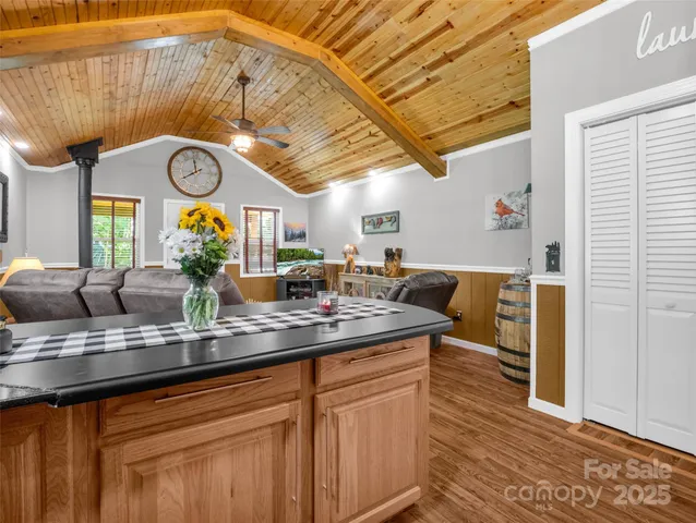 a view of a kitchen with a sink and a window