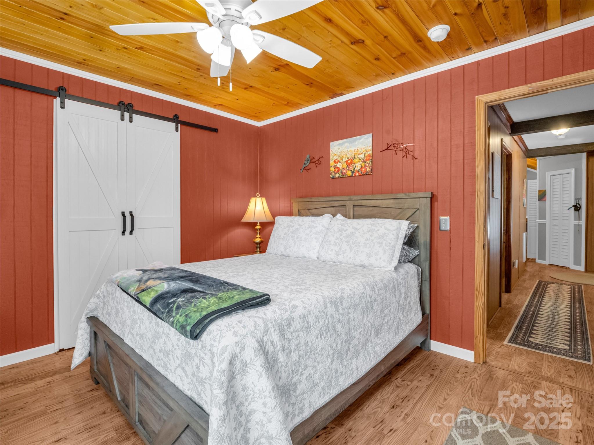 479 Camp Hill Road Mill Spring, NC 28756 - Photo 21 of 48 a bedroom with a bed and a mirror