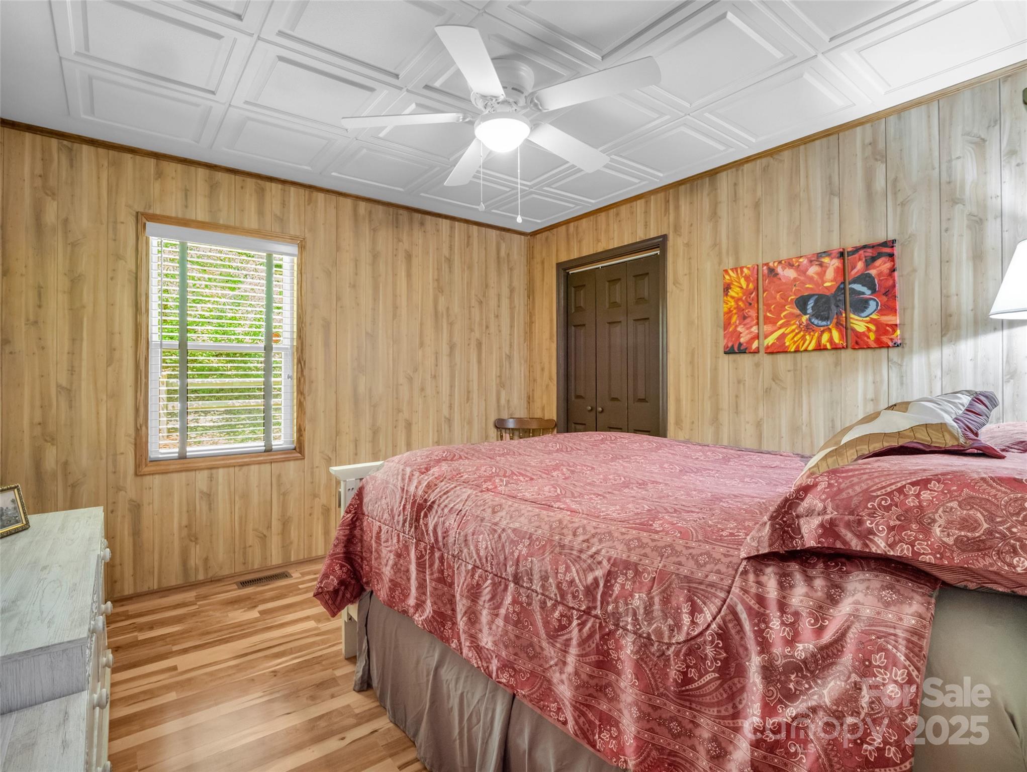 479 Camp Hill Road Mill Spring, NC 28756 - Photo 23 of 48 a bedroom with a bed and a painting on the wall