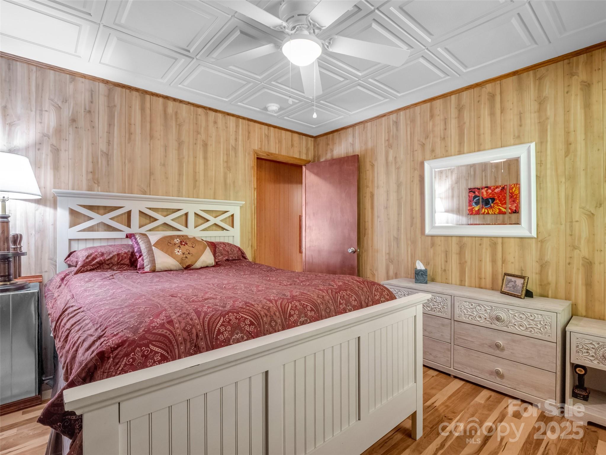 479 Camp Hill Road Mill Spring, NC 28756 - Photo 25 of 48 a bedroom with a bed and a window