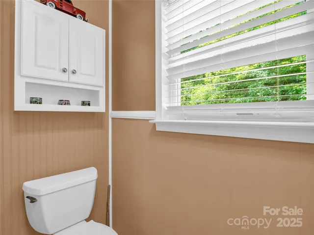 a bathroom with a toilet and a sink