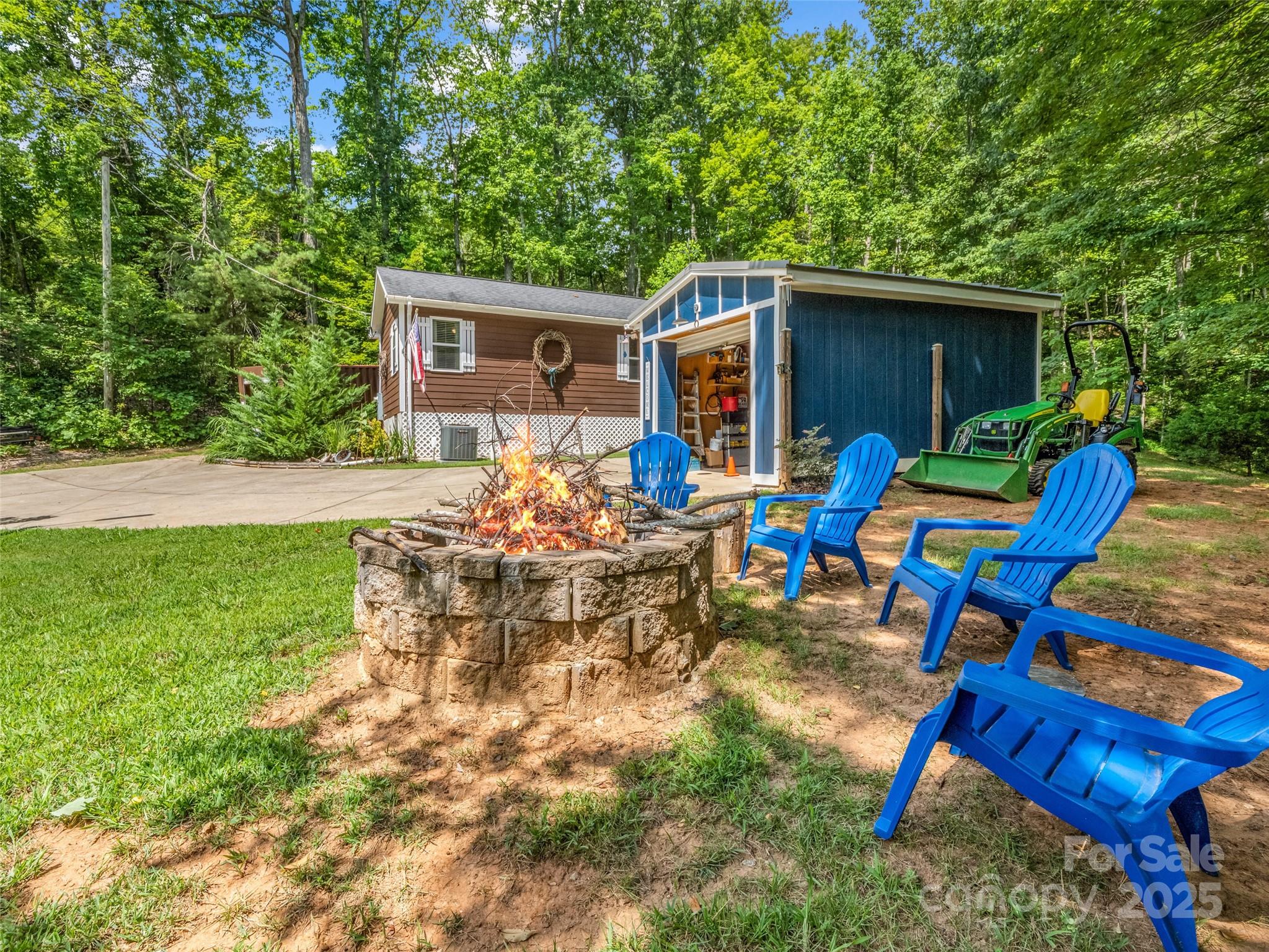 479 Camp Hill Road Mill Spring, NC 28756 - Photo 31 of 48 a view of backyard with outdoor seating and green space
