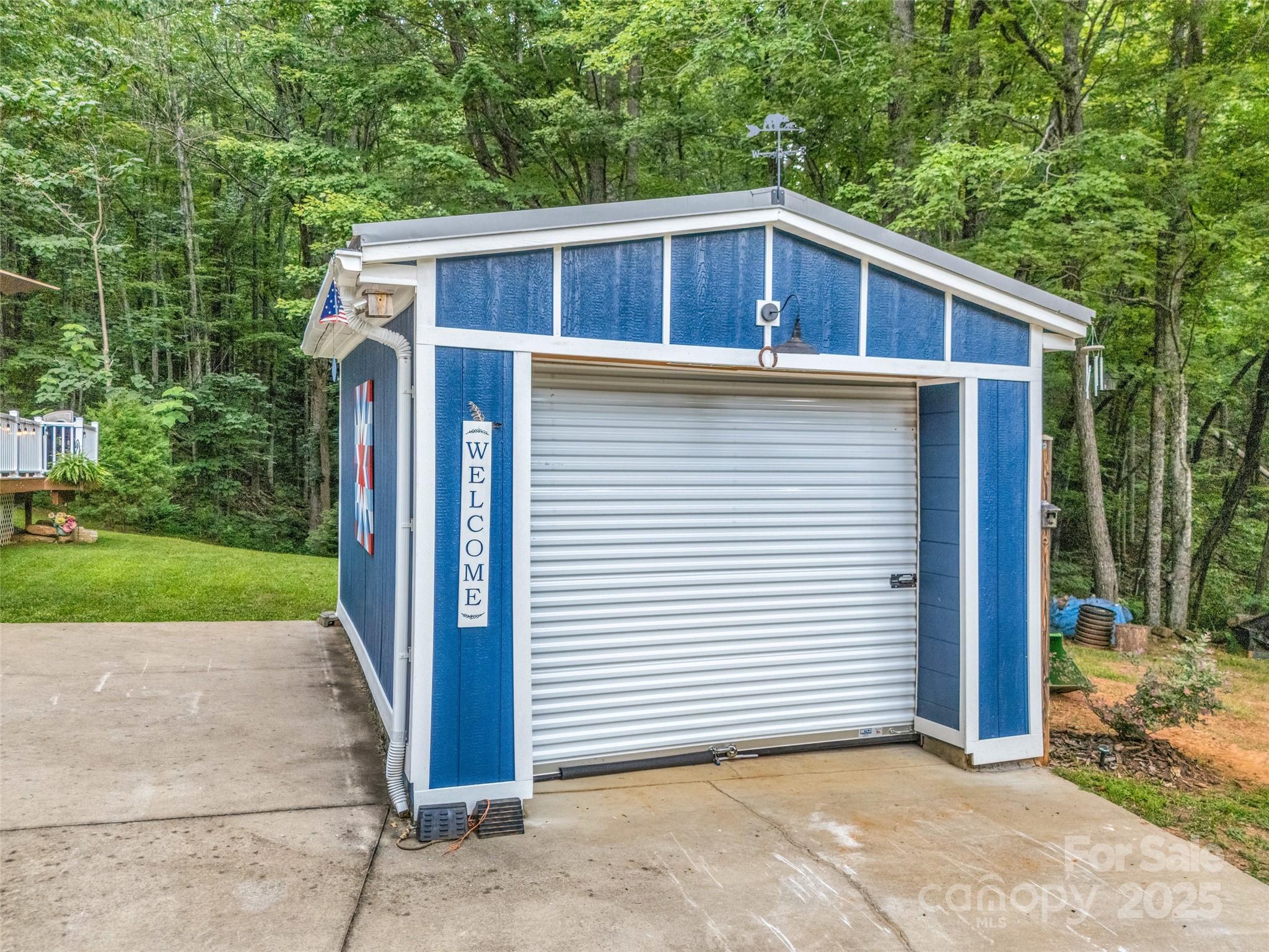 479 Camp Hill Road Mill Spring, NC 28756 - Photo 32 of 48 a front view of a house with a yard