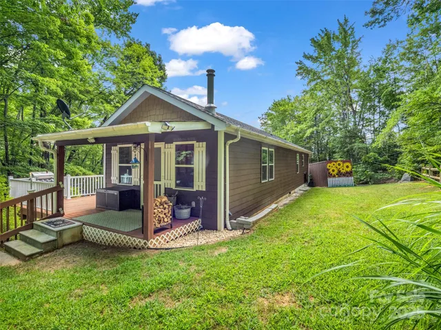 a view of a house with backyard porch and sitting area