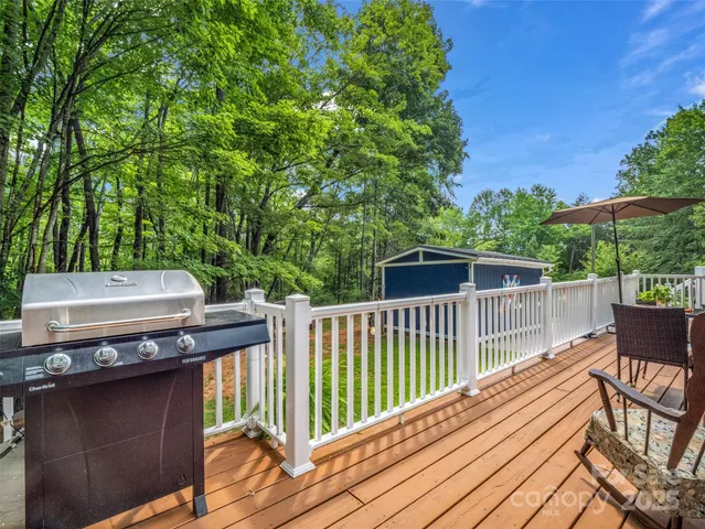 a view of a deck with a table and chairs with wooden floor