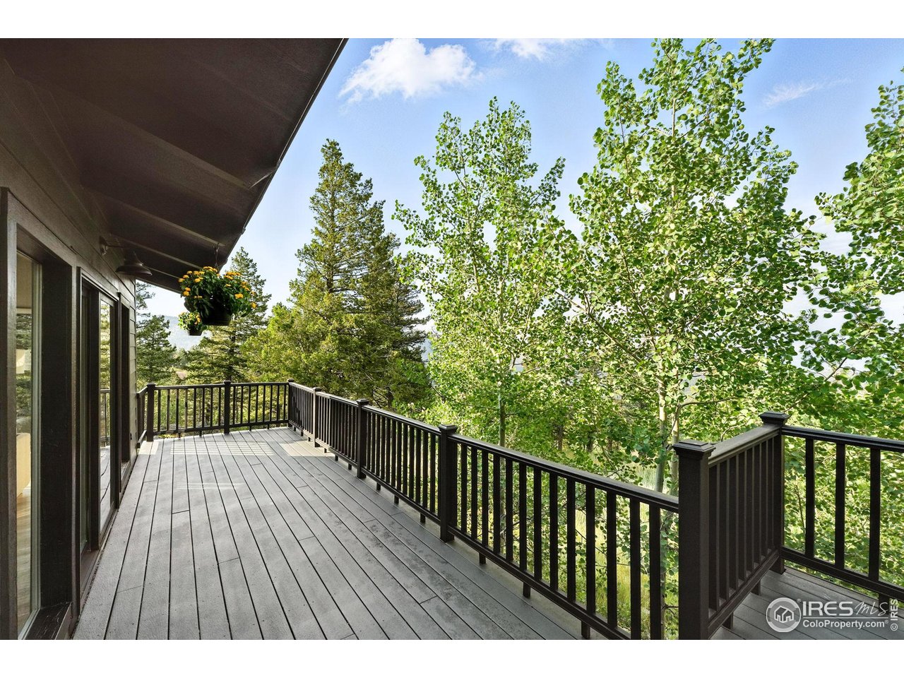 1575 Deer Trail Road Boulder, CO 80302 - Photo 11 of 39 a balcony with wooden floor
