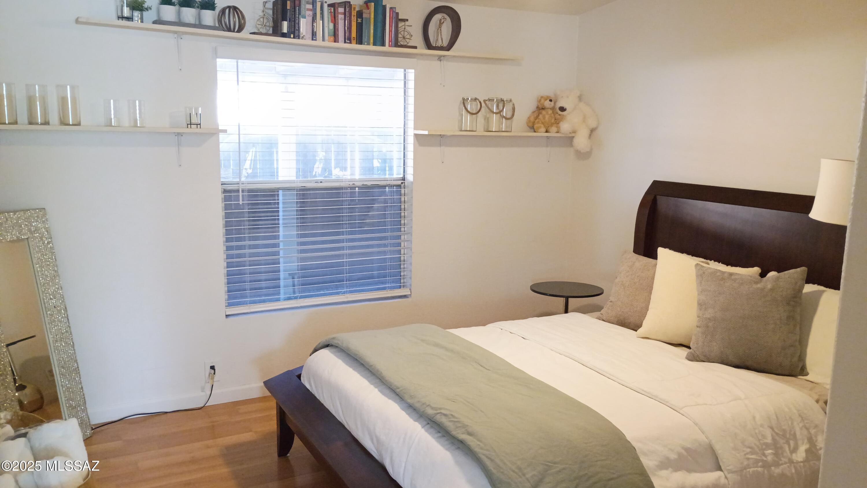 1449 West Hualpai Road Tucson, AZ 85745 - Photo 21 of 49 a bedroom with a bed and a window