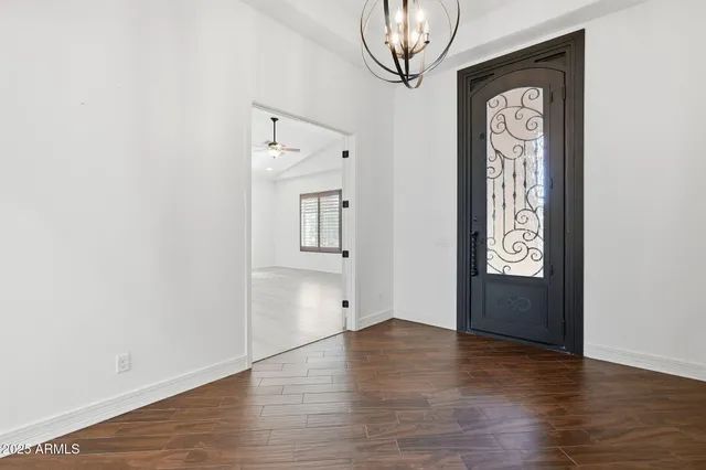 a kitchen with stainless steel appliances kitchen island granite countertop a sink and cabinets
