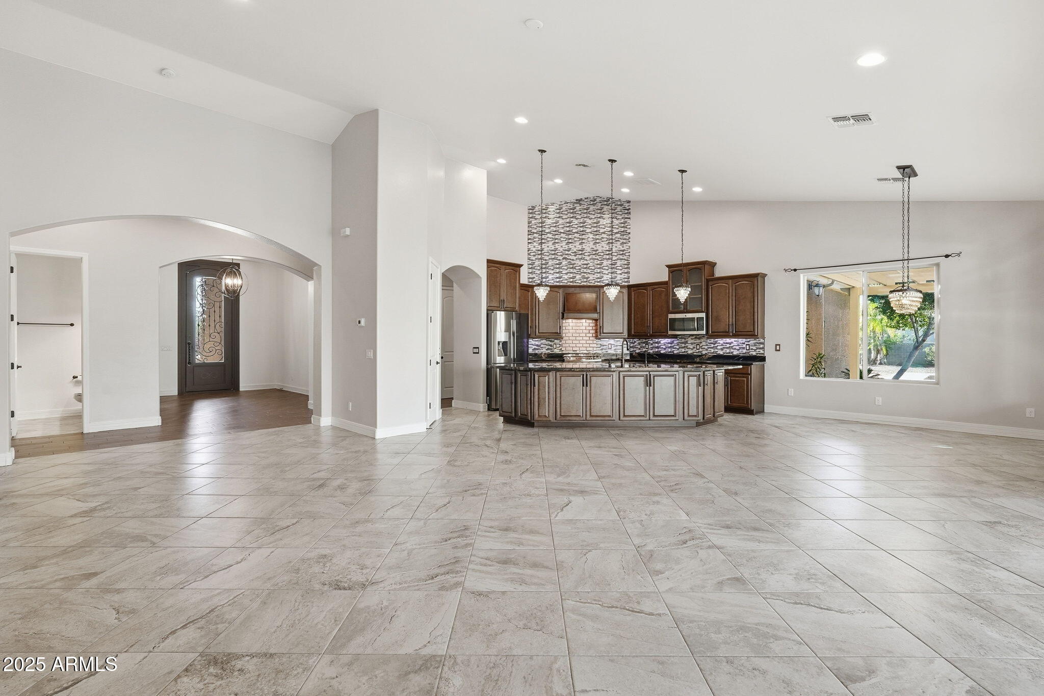 2218 East Brooks Farm Road Gilbert, AZ 85298 - Photo 18 of 55 a view of kitchen with furniture and flat screen tv