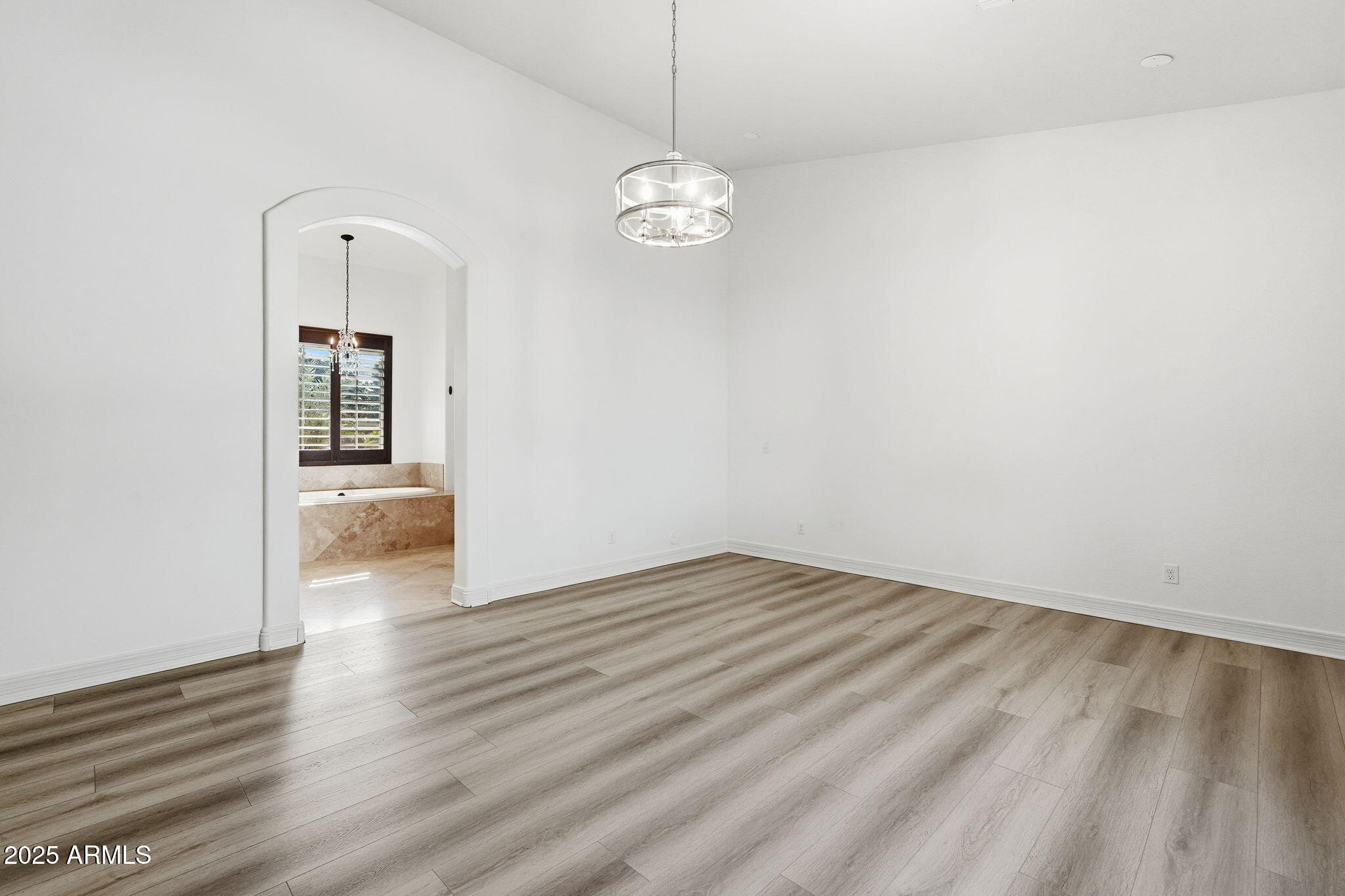 2218 East Brooks Farm Road Gilbert, AZ 85298 - Photo 27 of 55 a view of a hallway with wooden floor and a large window