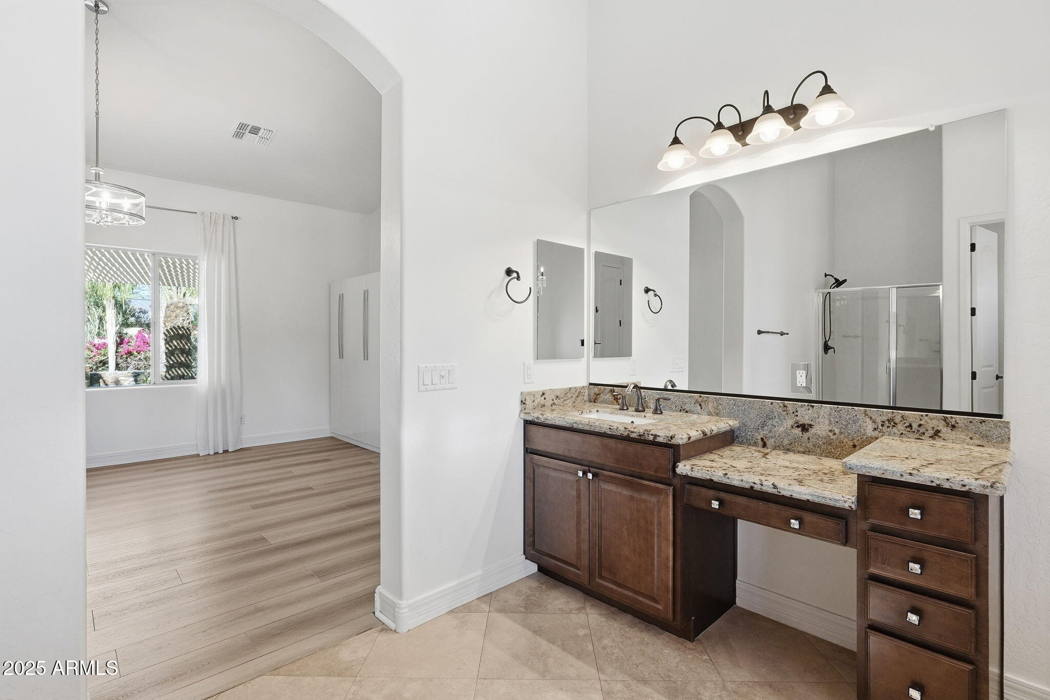 2218 East Brooks Farm Road Gilbert, AZ 85298 - Photo 33 of 55 a bathroom with a granite countertop sink and a mirror