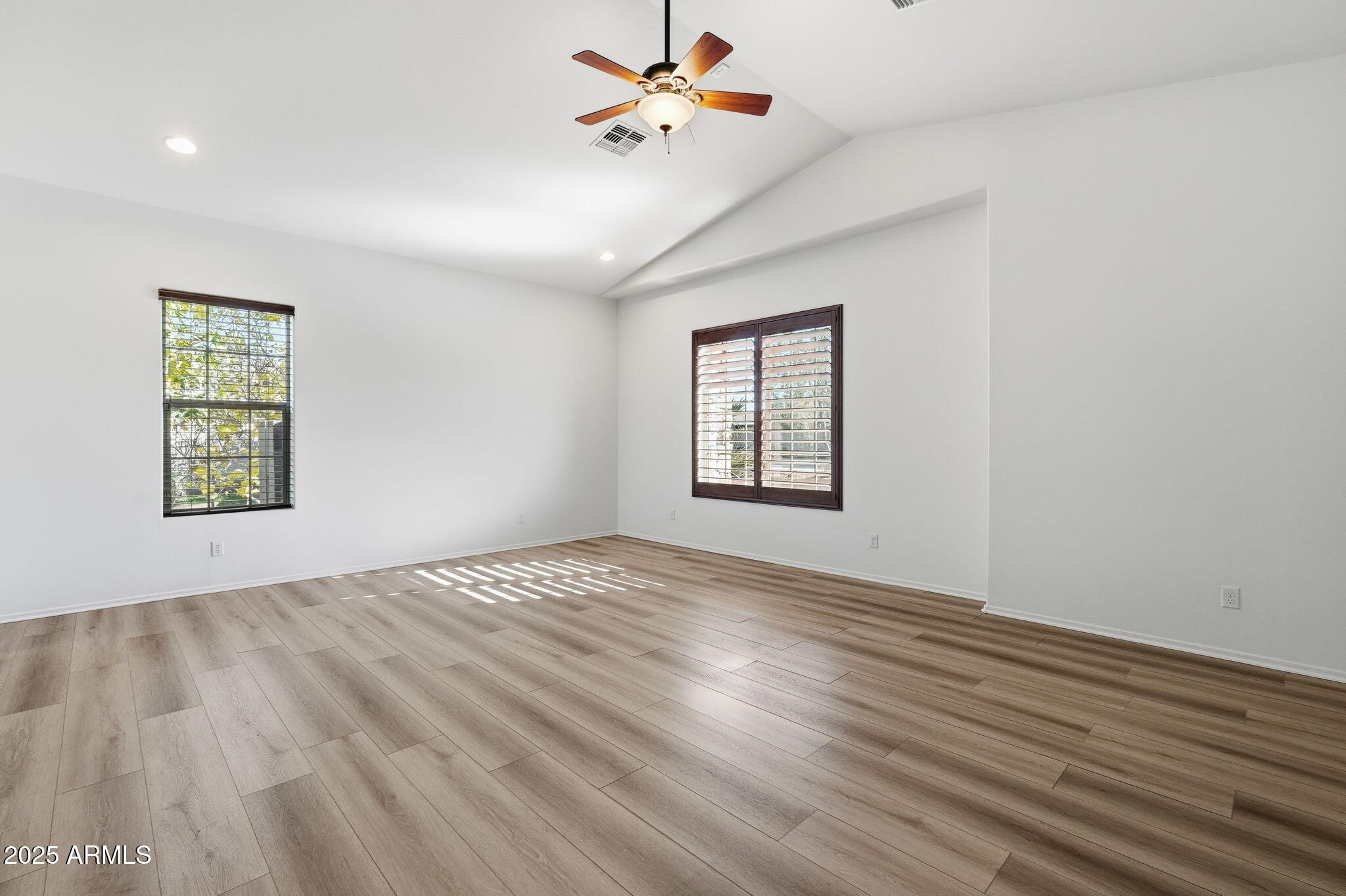 2218 East Brooks Farm Road Gilbert, AZ 85298 - Photo 34 of 55 wooden floor in an empty room with a window