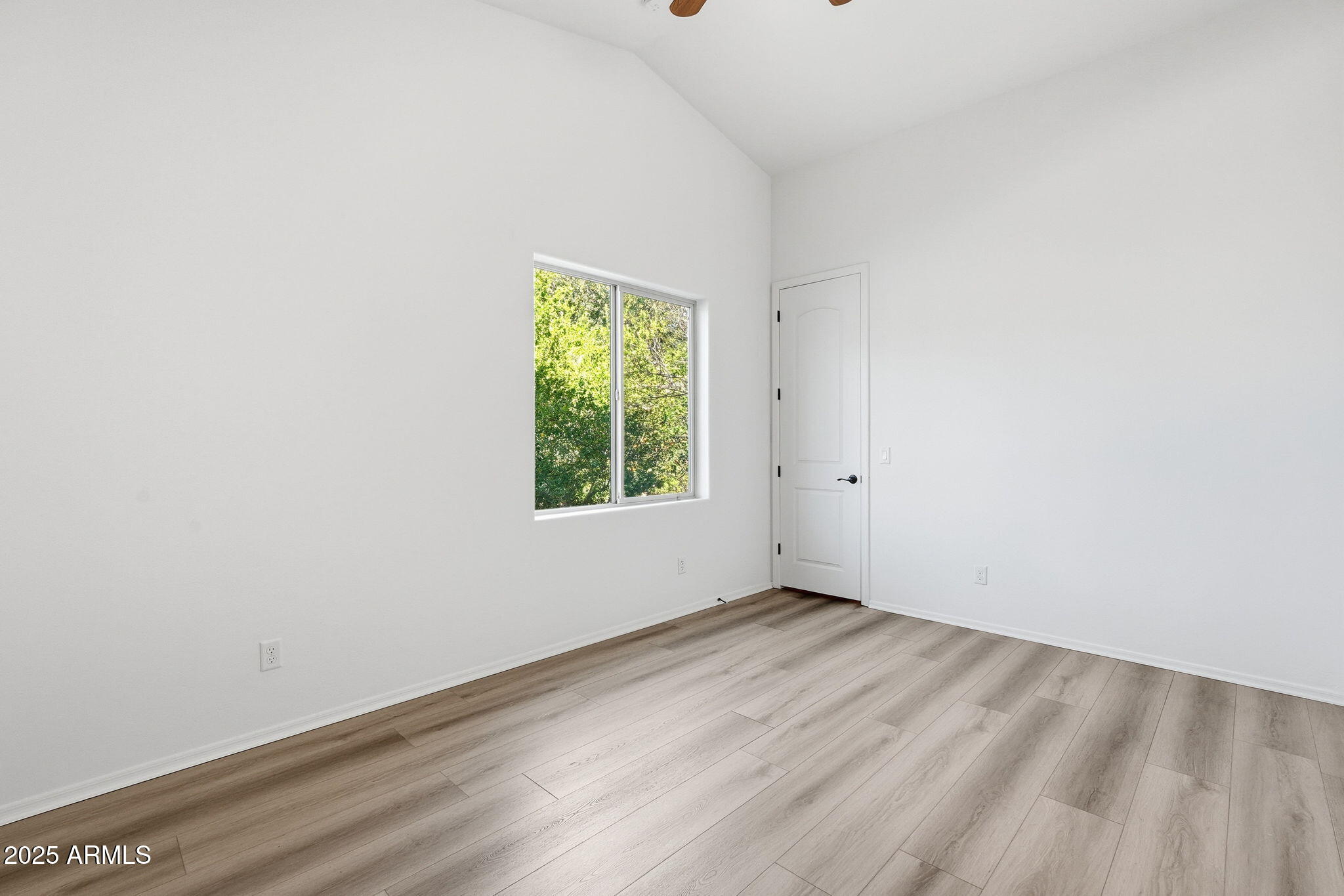 2218 East Brooks Farm Road Gilbert, AZ 85298 - Photo 38 of 55 an empty room with a window